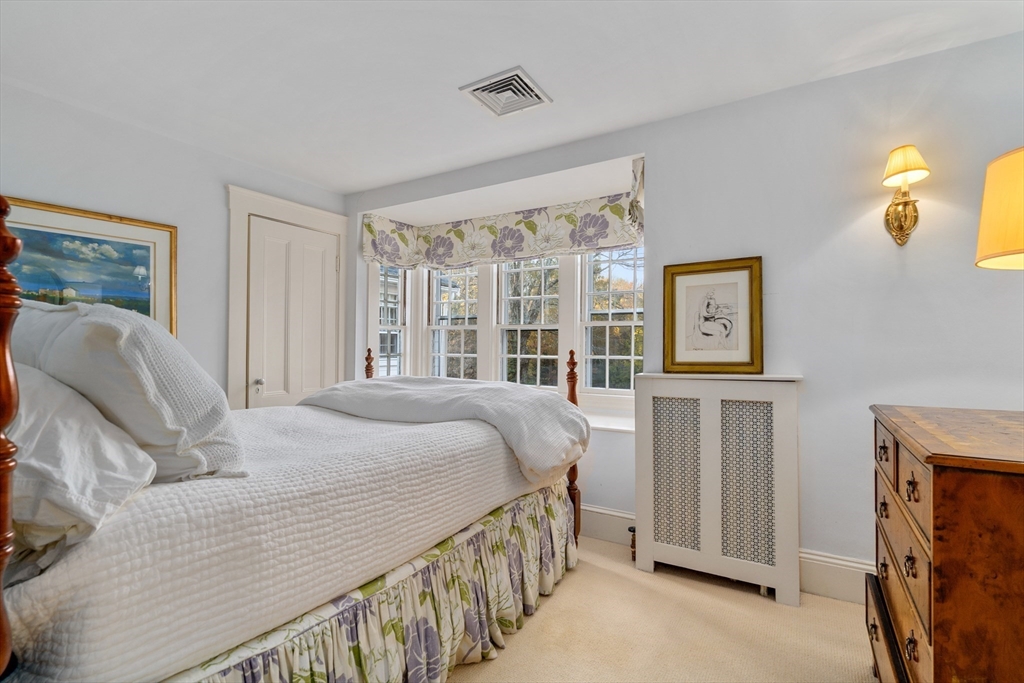 883 High Street Dedham, MA 02026 - Photo 17 of 42 a bedroom with a bed and a window