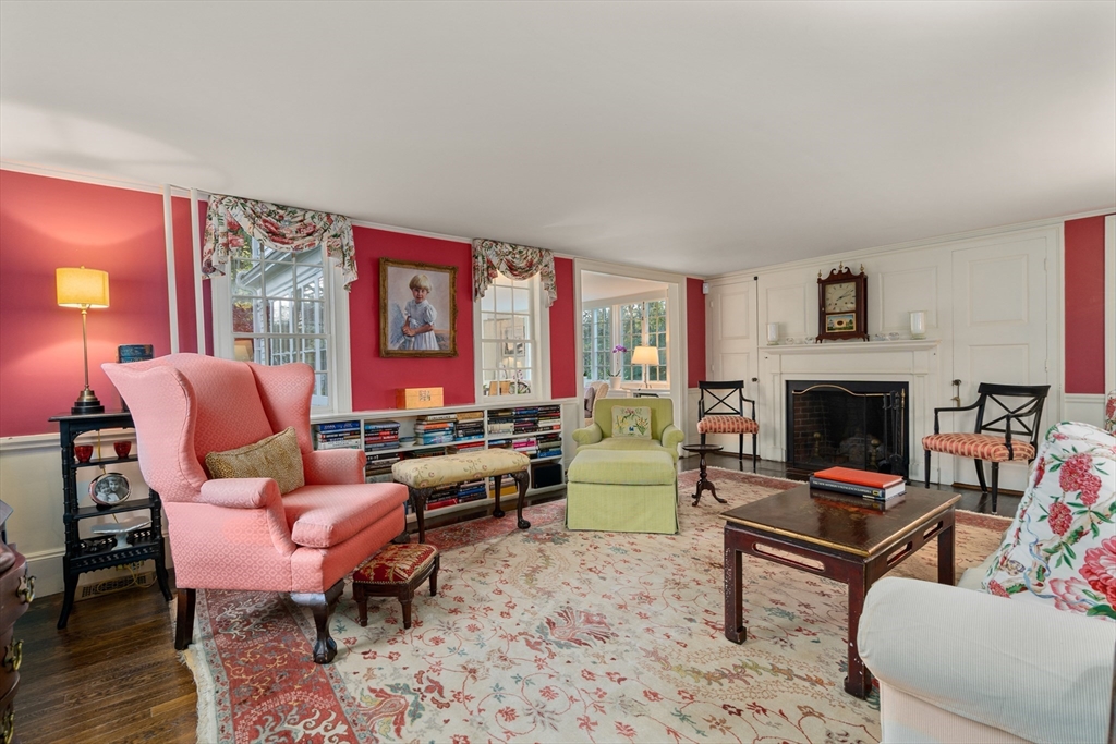 883 High Street Dedham, MA 02026 - Photo 2 of 42 a living room with furniture a rug and a fireplace