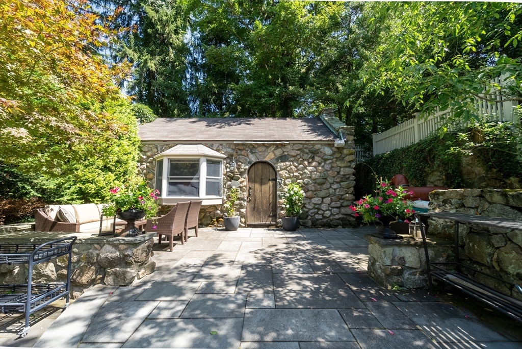 883 High Street Dedham, MA 02026 - Photo 29 of 42 a front view of a house with a yard