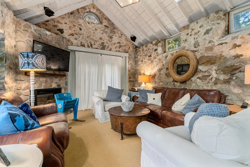 883 High Street Dedham, MA 02026 - Photo 31 of 42 a living room with furniture and a fireplace