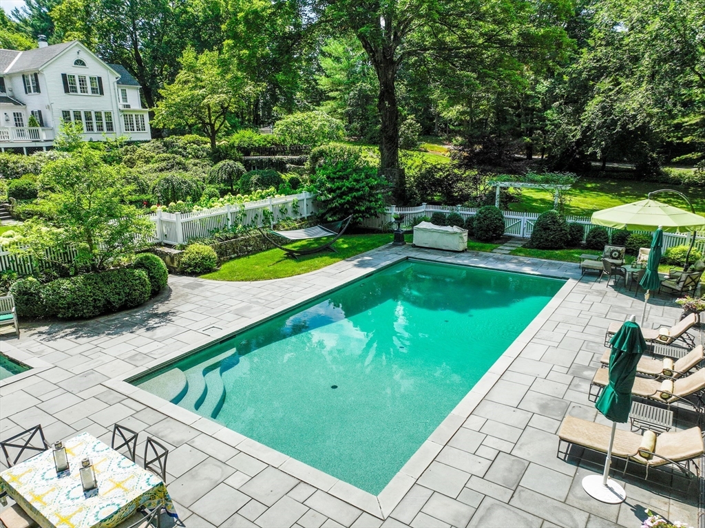 883 High Street Dedham, MA 02026 - Photo 35 of 42 a view of a backyard with a garden and plants