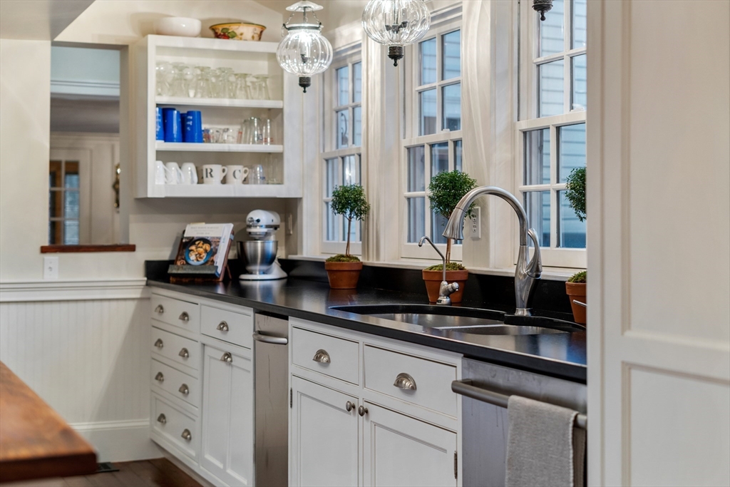 883 High Street Dedham, MA 02026 - Photo 8 of 42 a counter top space with a sink and cabinets