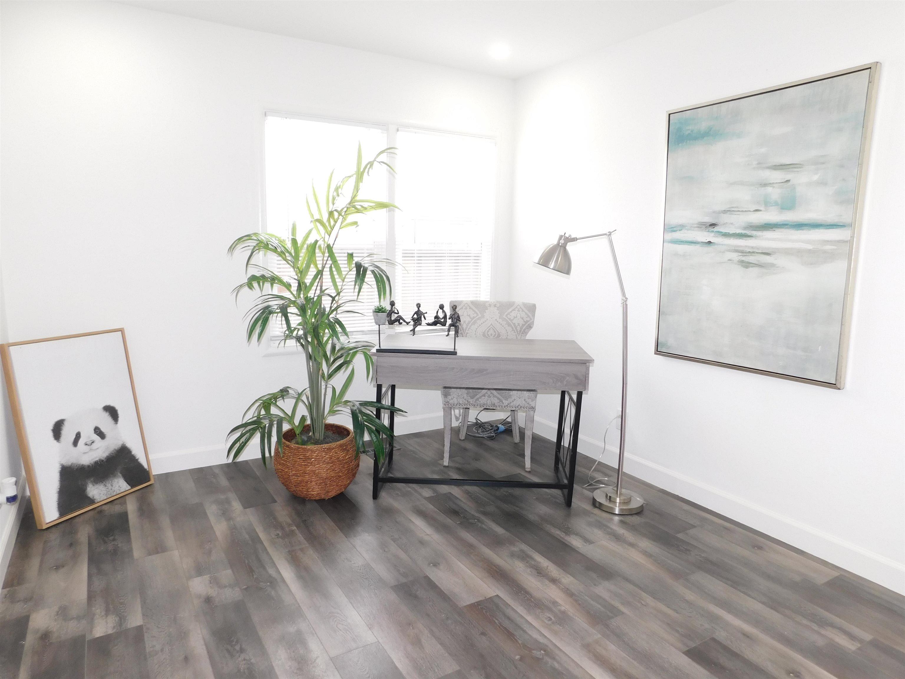 15018 Edgemoor Street San Leandro, CA 94579 - Photo 4 of 13 a living room with furniture and a potted plant