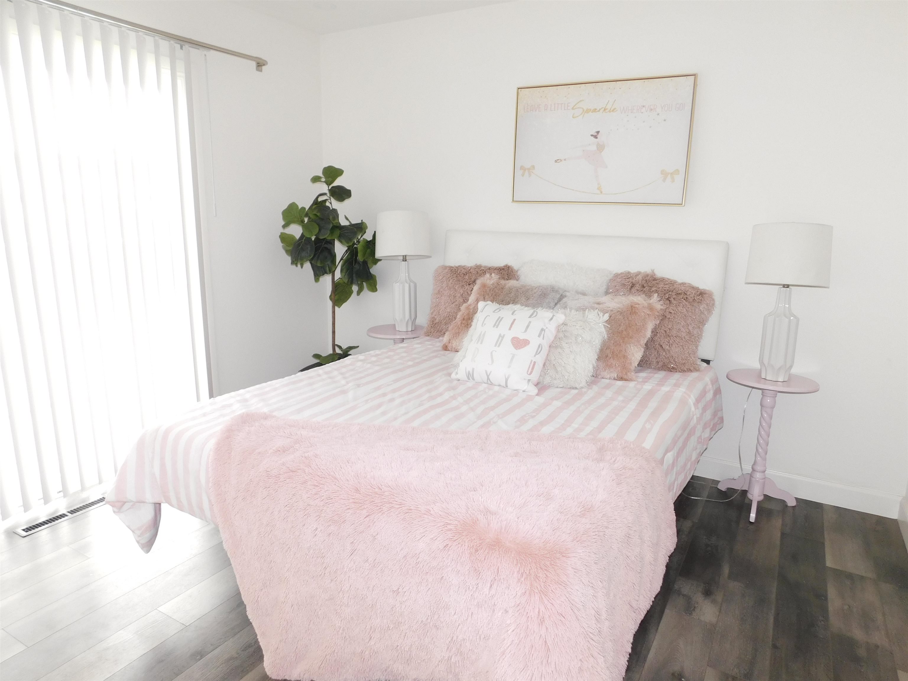 15018 Edgemoor Street San Leandro, CA 94579 - Photo 6 of 13 a bedroom with a bed and a potted plant