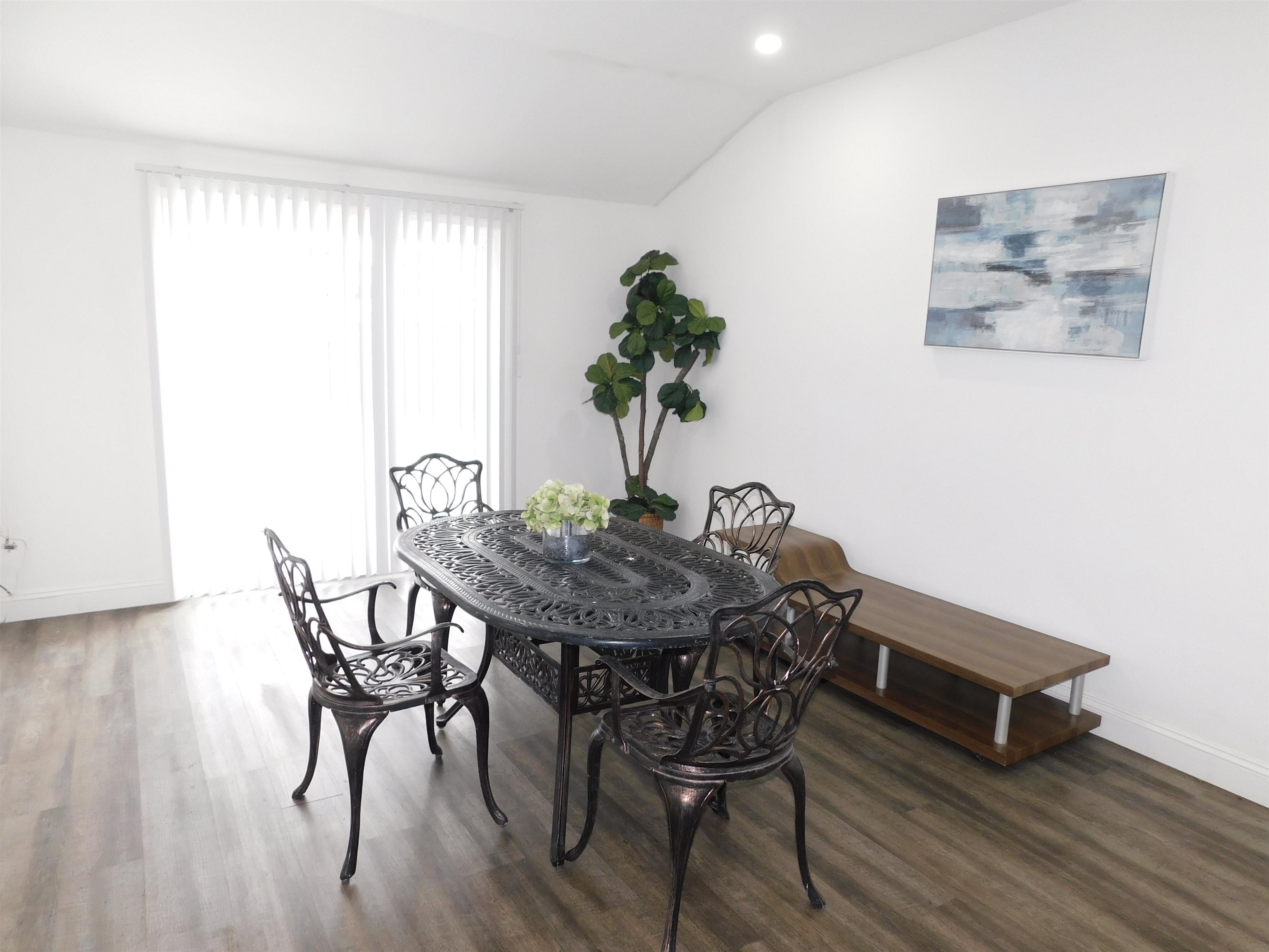 15018 Edgemoor Street San Leandro, CA 94579 - Photo 10 of 13 a view of a dining room with furniture and wooden floor