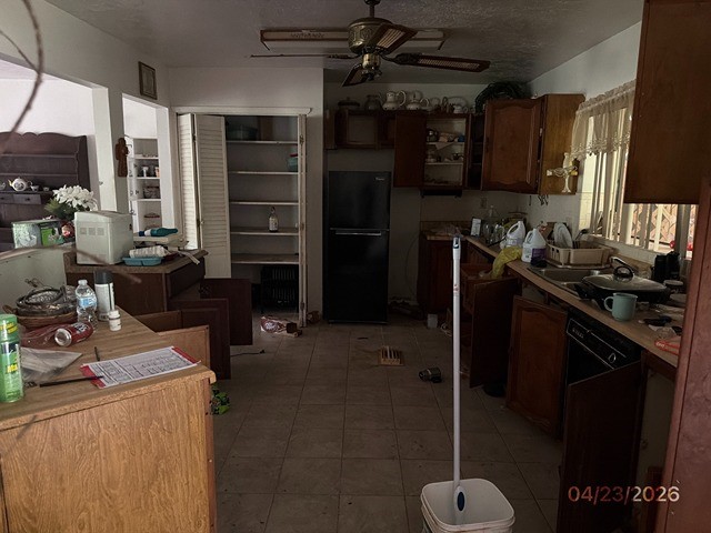 10580 Greenridge Road Conroe, TX 77303 - Photo 3 of 10 a kitchen with a sink appliances and cabinets