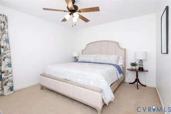 a bed room with a bed and a chandelier