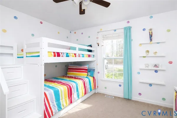 a room that has a bed and a dresser in it