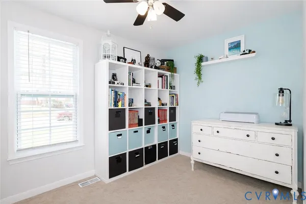 a bedroom with windows