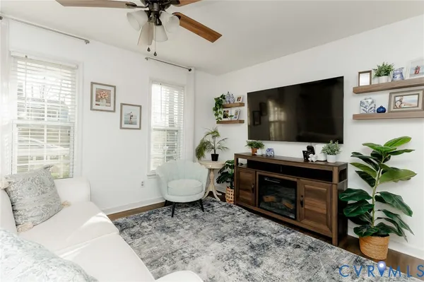 a living room with furniture and a flat screen tv