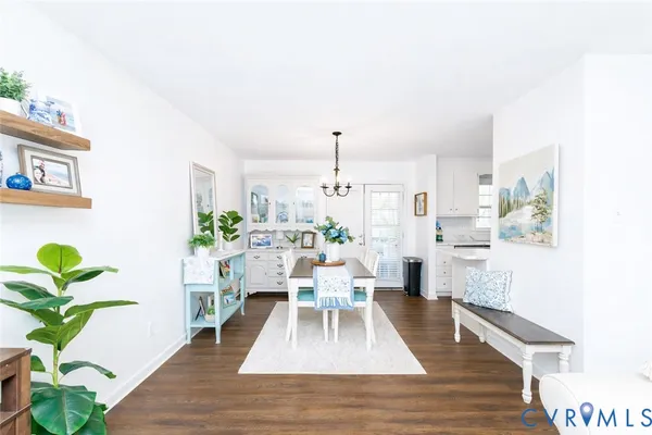 a living room with furniture potted plant and a rug