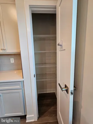 a view of a balcony with wooden floor