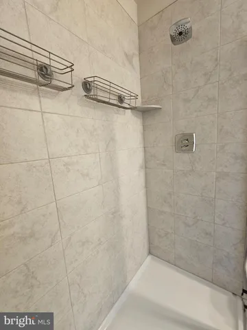 a bathroom with a sink a toilet and a bathtub