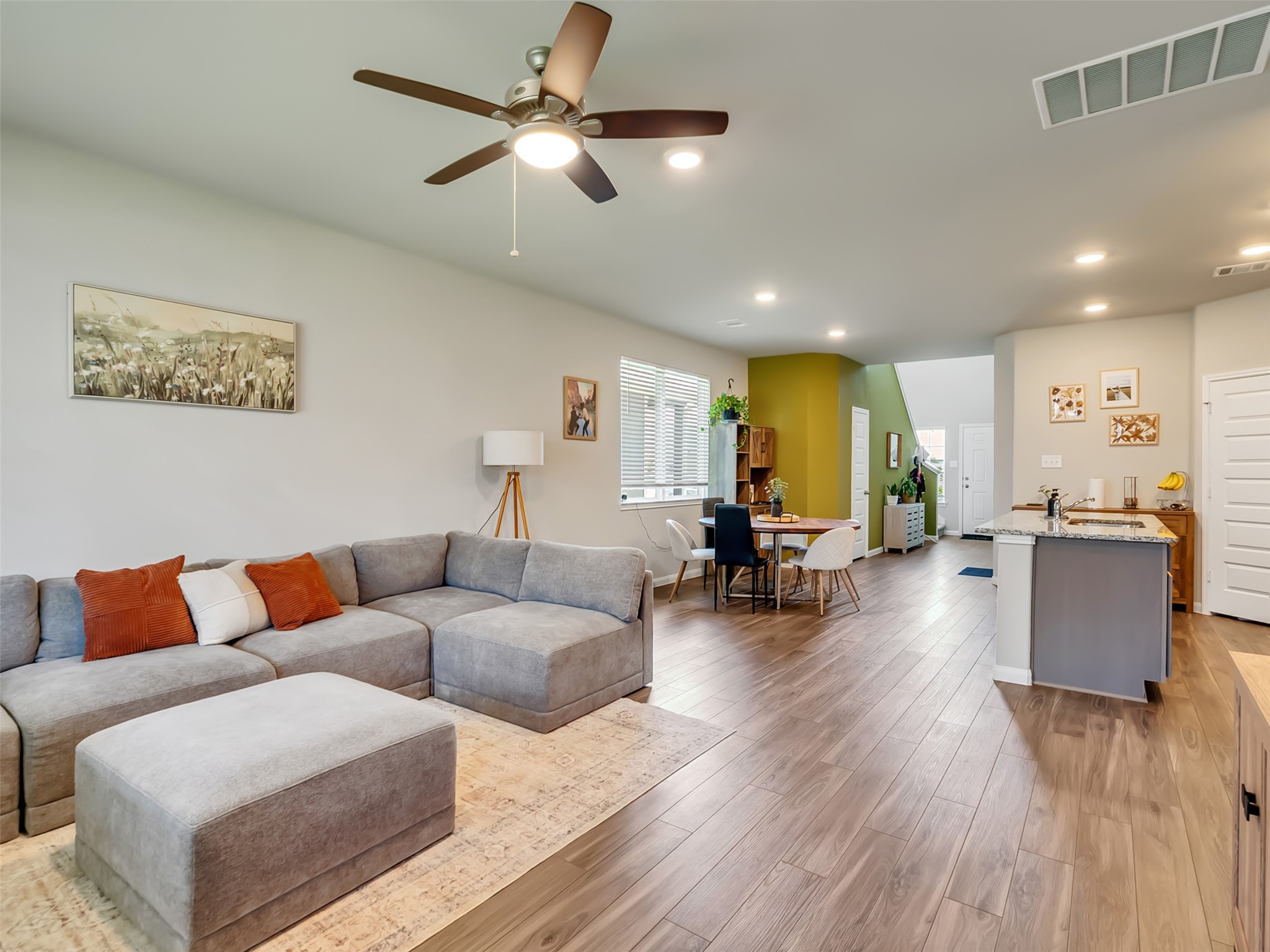 2416 Bluefish Court Conroe, TX 77384 - Photo 31 of 45 a living room with furniture and a wooden floor