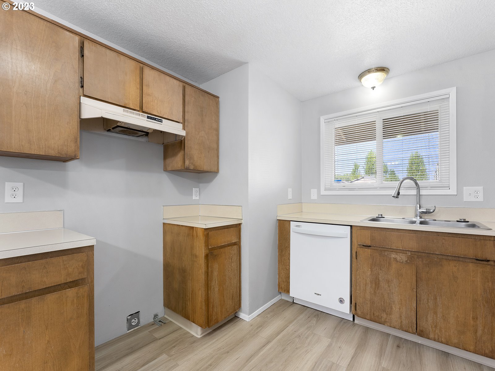 964 Southwest 179th Avenue Beaverton, OR 97003 - Photo 12 of 27 a kitchen with a sink cabinets and wooden floor