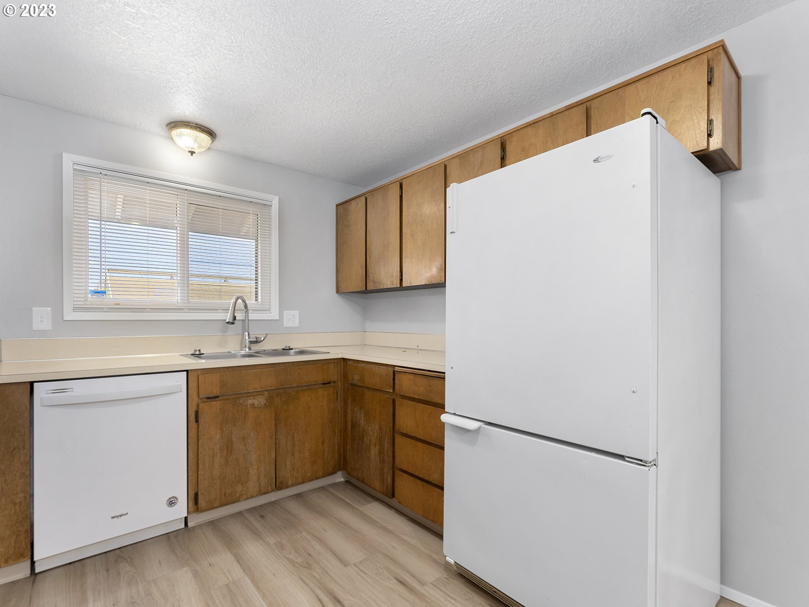 964 Southwest 179th Avenue Beaverton, OR 97003 - Photo 13 of 27 a kitchen with a white cabinets and white appliances