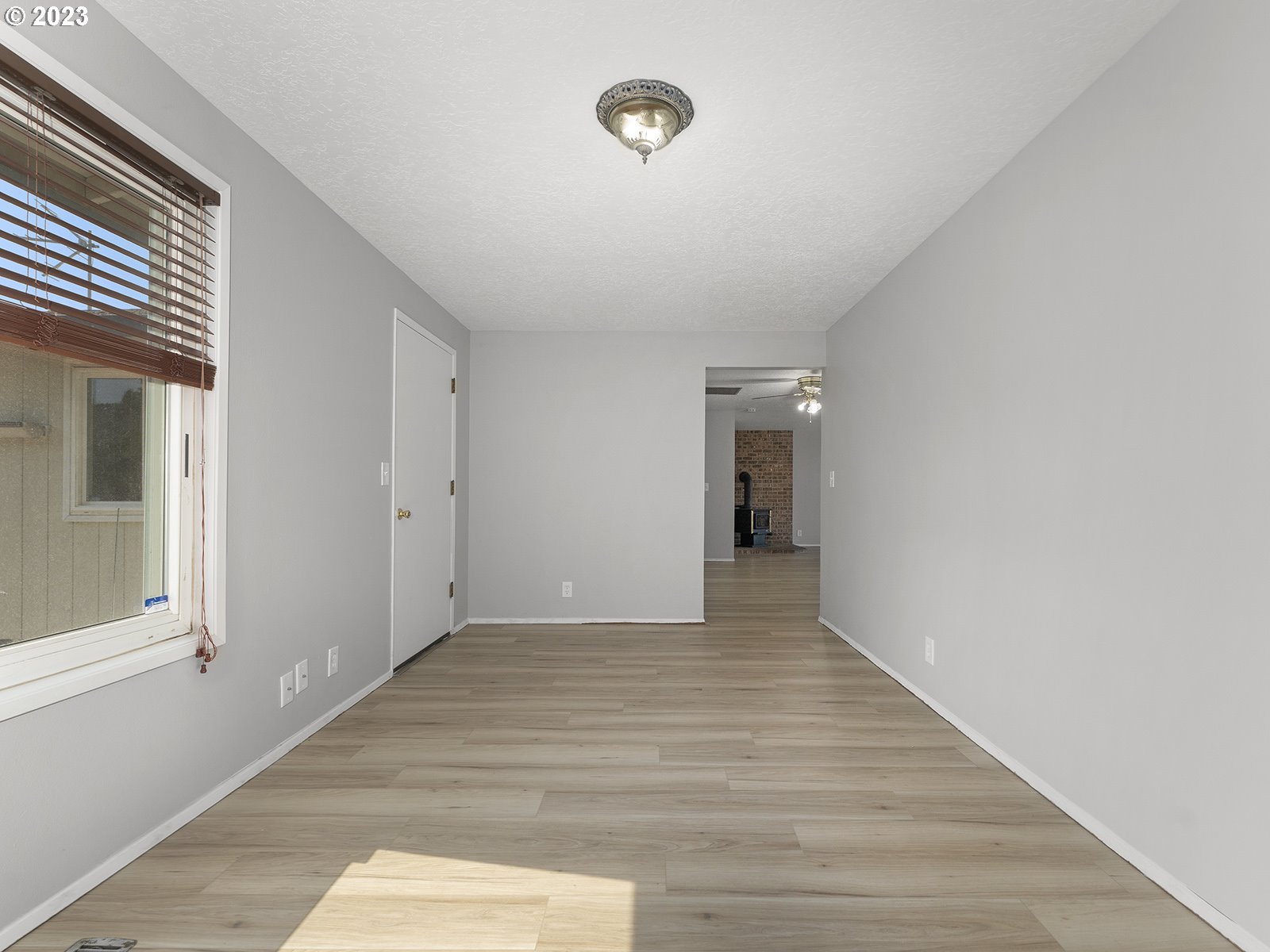 964 Southwest 179th Avenue Beaverton, OR 97003 - Photo 16 of 27 a view of an empty room with wooden floor and a window