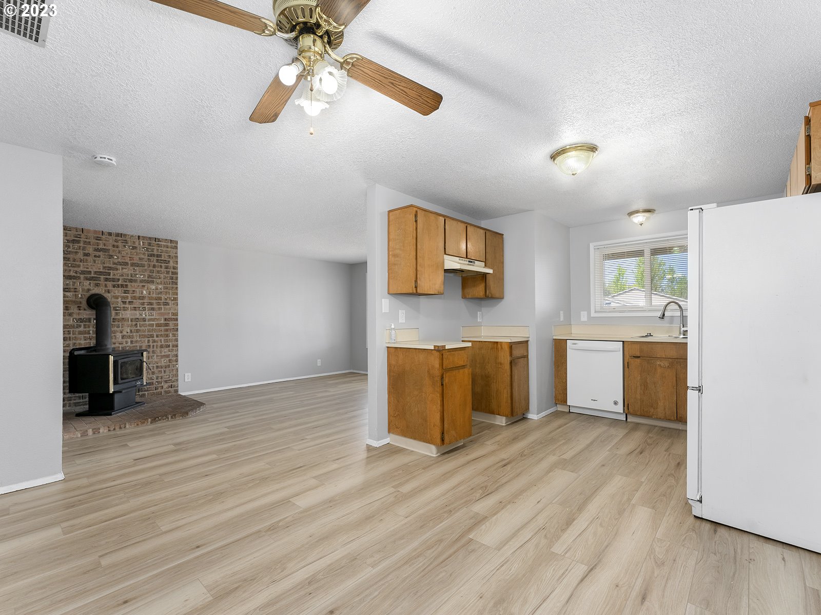 964 Southwest 179th Avenue Beaverton, OR 97003 - Photo 10 of 27 a kitchen with stainless steel appliances granite countertop a refrigerator and a sink