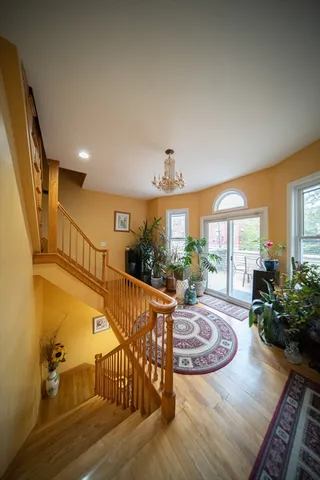 a view of a livingroom with furniture window and wooden floor
