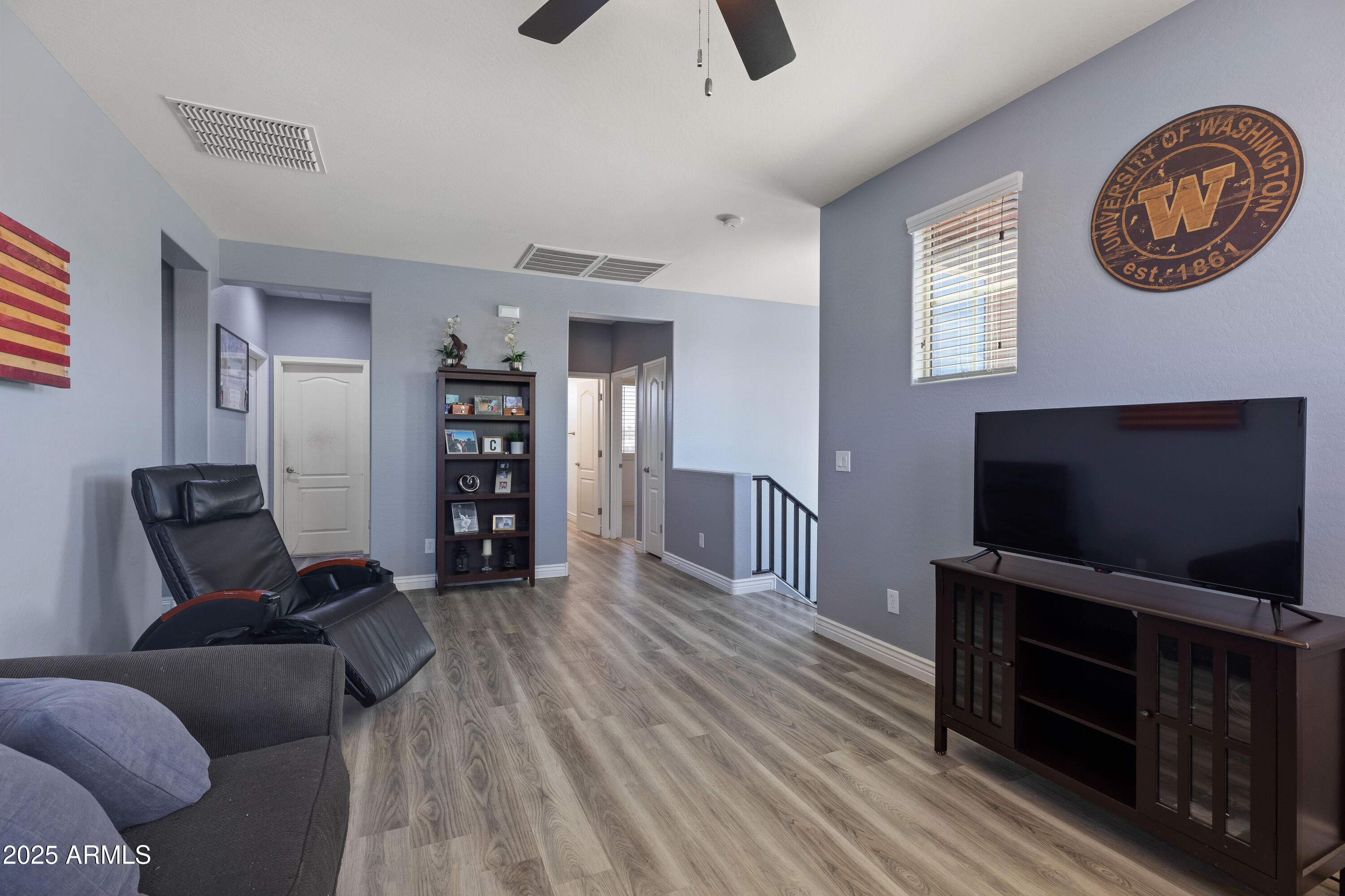 18649 West Williams Street Goodyear, AZ 85338 - Photo 18 of 42 a living room with furniture and a flat screen tv