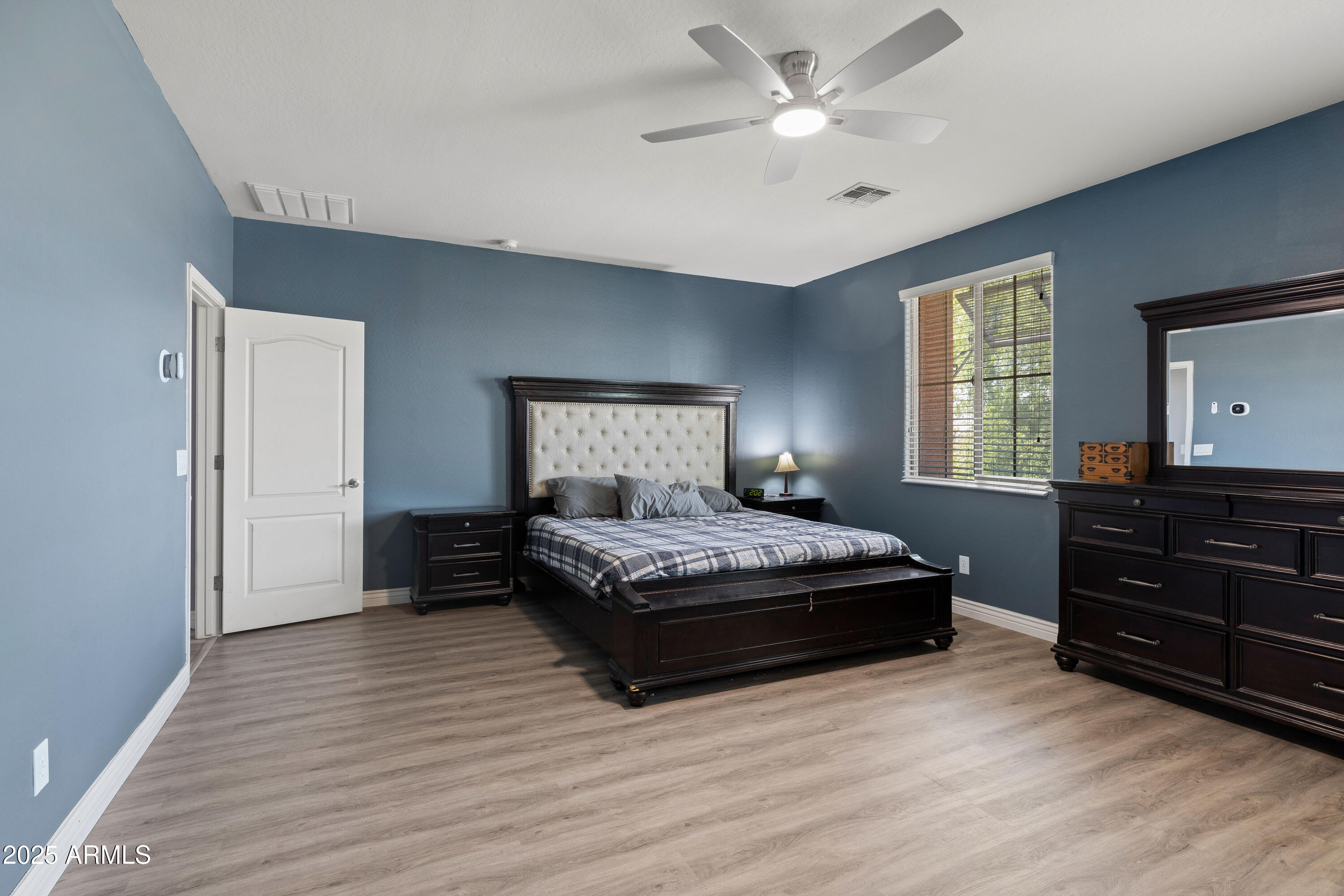 18649 West Williams Street Goodyear, AZ 85338 - Photo 20 of 42 a bedroom with a bed and window