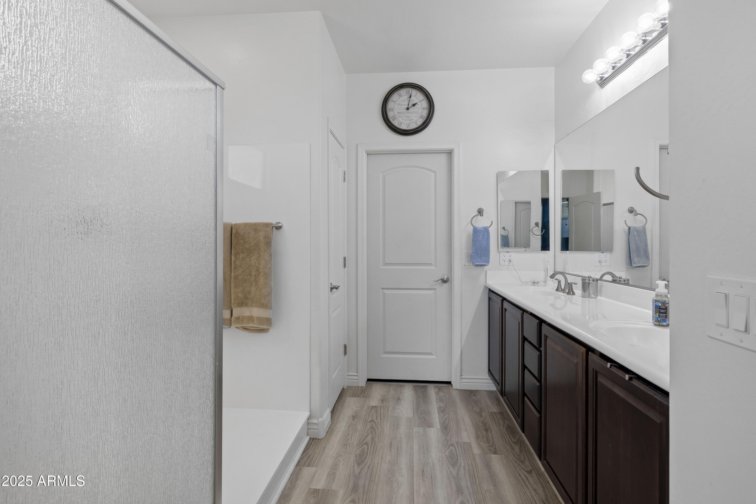 18649 West Williams Street Goodyear, AZ 85338 - Photo 21 of 42 a bathroom with a double vanity sink and a mirror