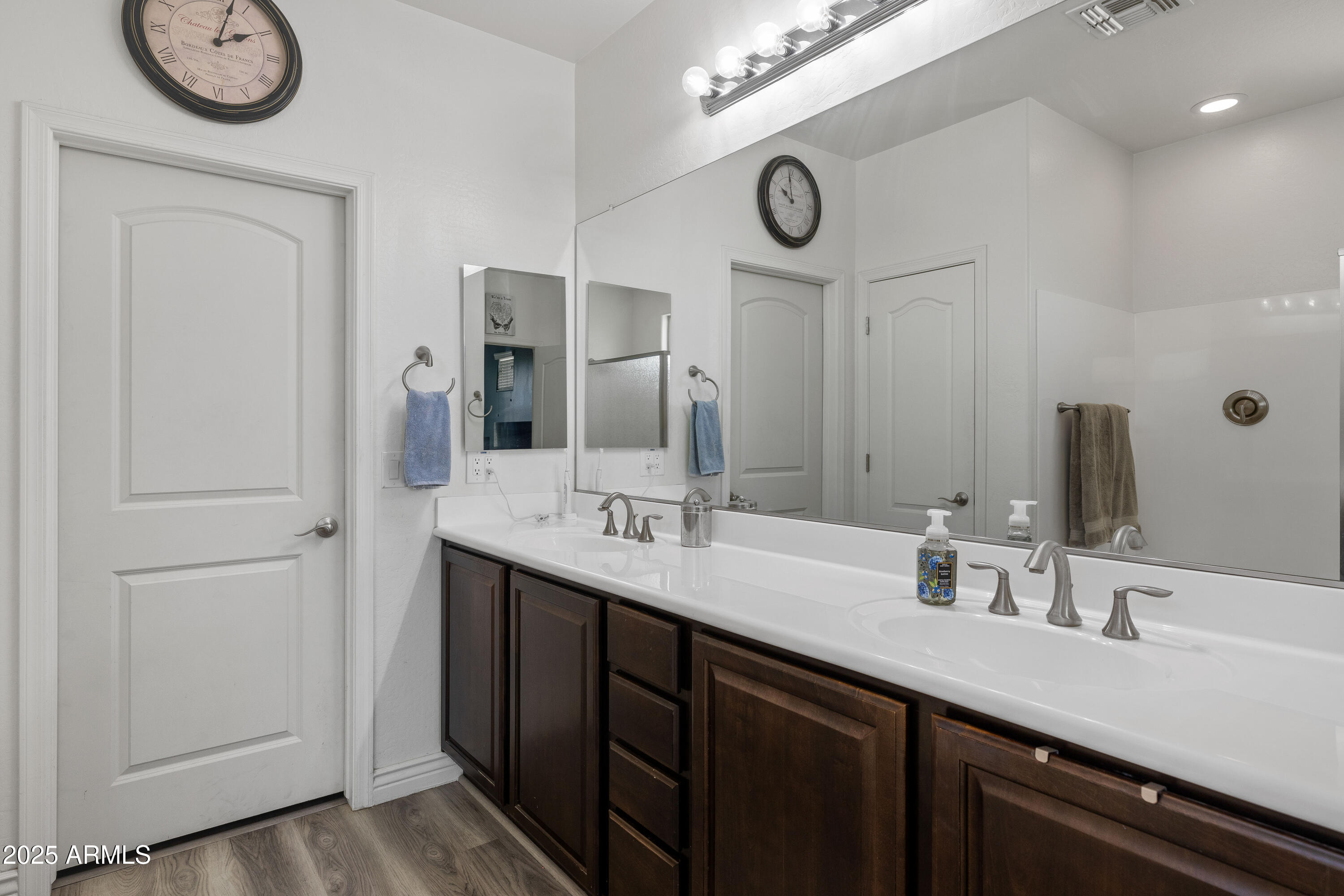 18649 West Williams Street Goodyear, AZ 85338 - Photo 22 of 42 a bathroom with a double vanity sink and a mirror