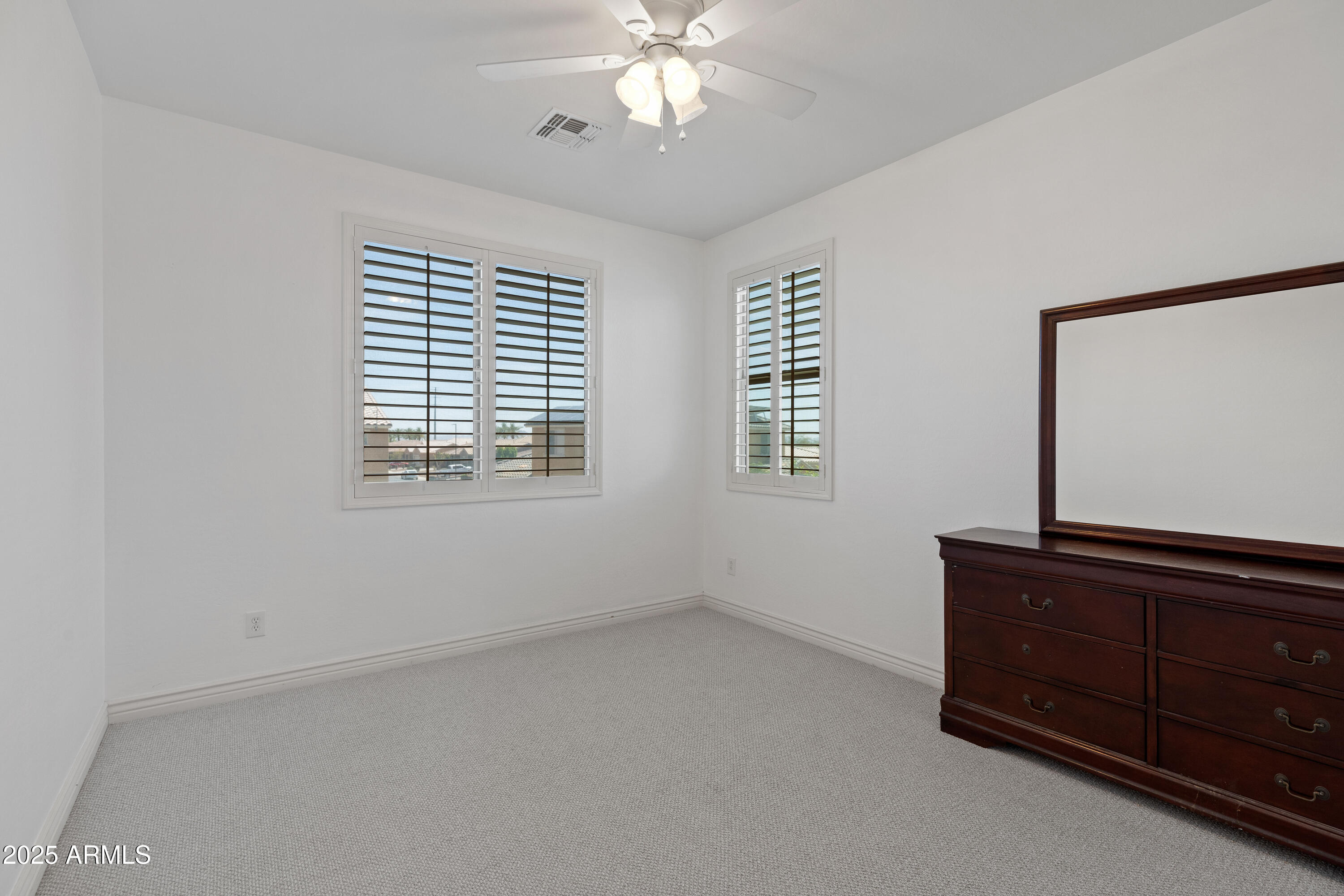 18649 West Williams Street Goodyear, AZ 85338 - Photo 26 of 42 a view of room with window and ceiling fan