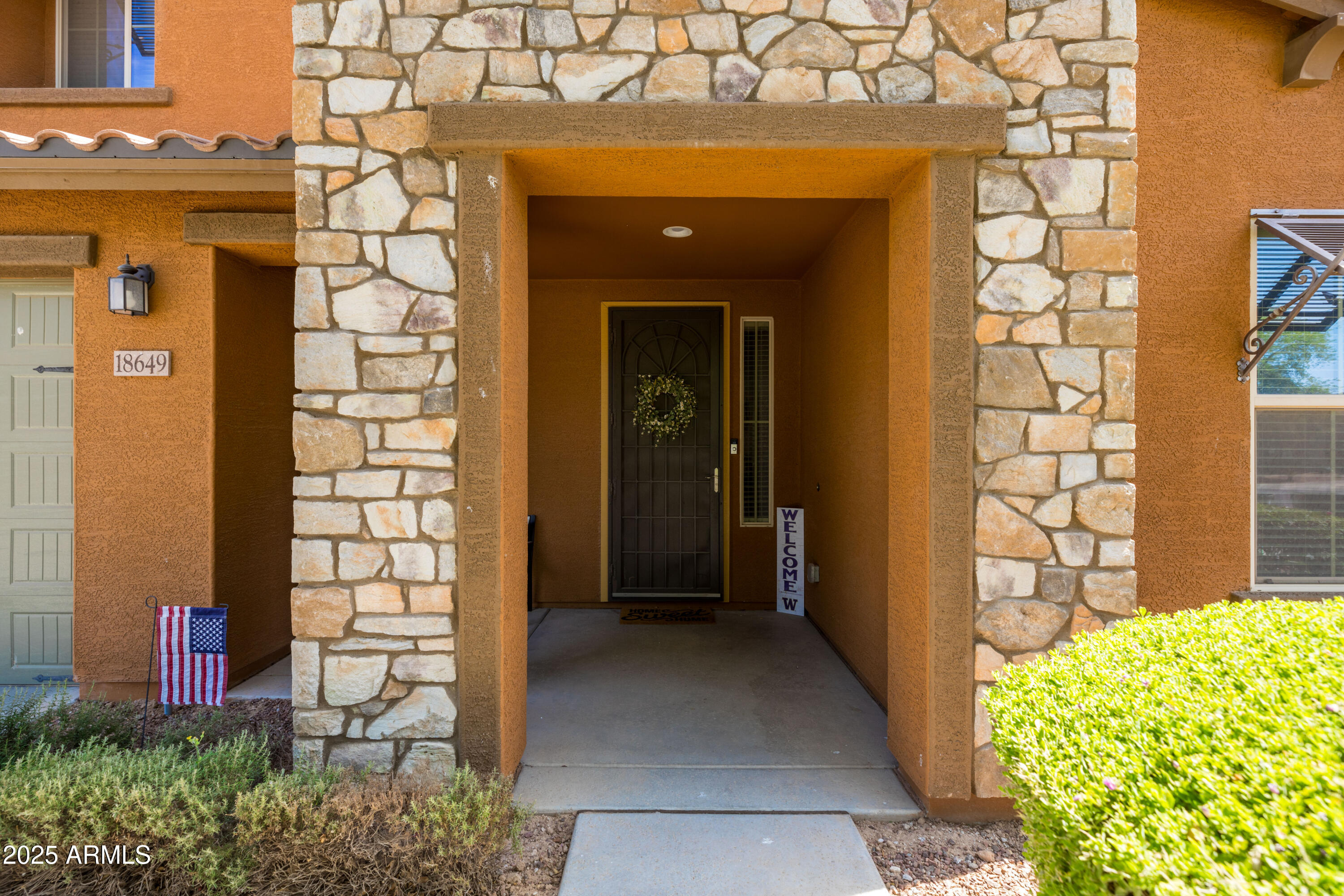 18649 West Williams Street Goodyear, AZ 85338 - Photo 3 of 42 a view of a front door of a house with a yard