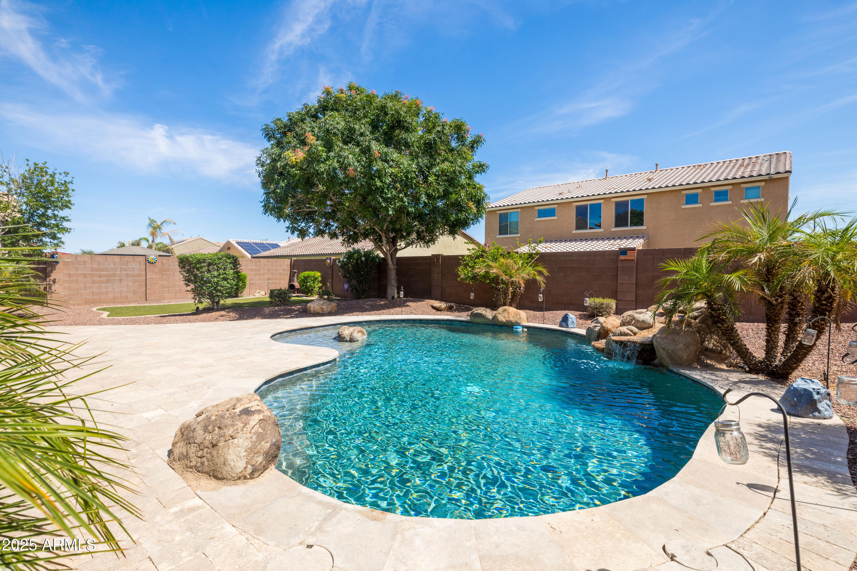 18649 West Williams Street Goodyear, AZ 85338 - Photo 31 of 42 a view of a swimming pool with a patio