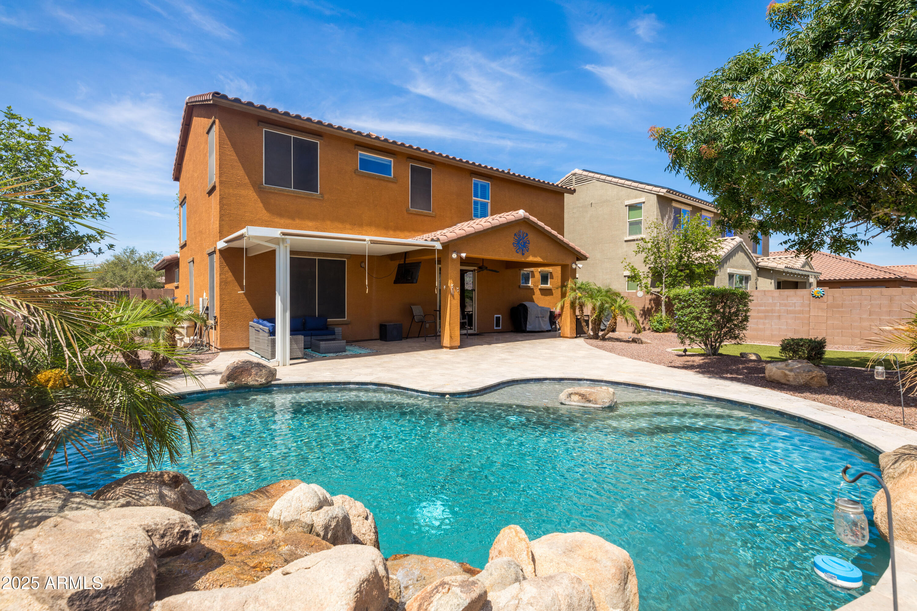 18649 West Williams Street Goodyear, AZ 85338 - Photo 35 of 42 a swimming pool with patio outdoor seating and yard
