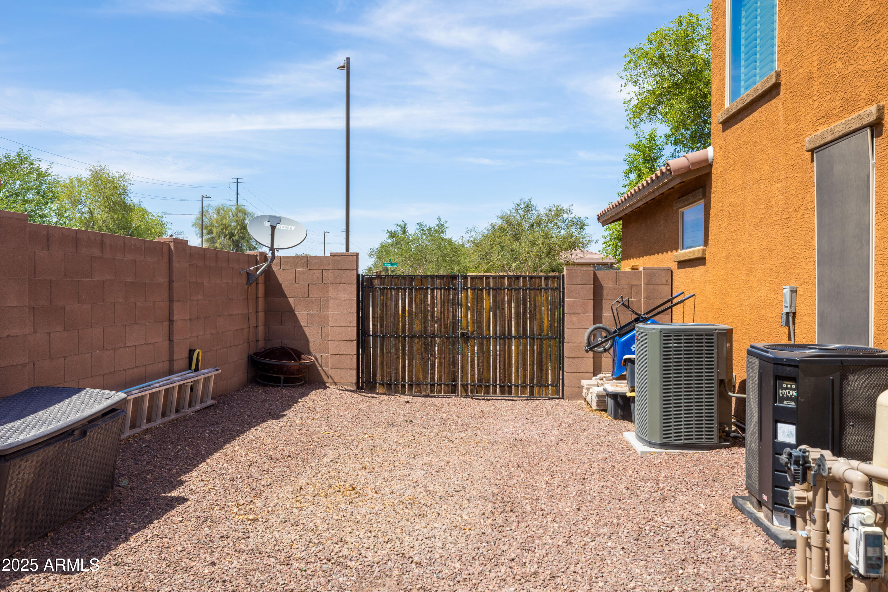 18649 West Williams Street Goodyear, AZ 85338 - Photo 37 of 42 a view of roof deck with wooden fence