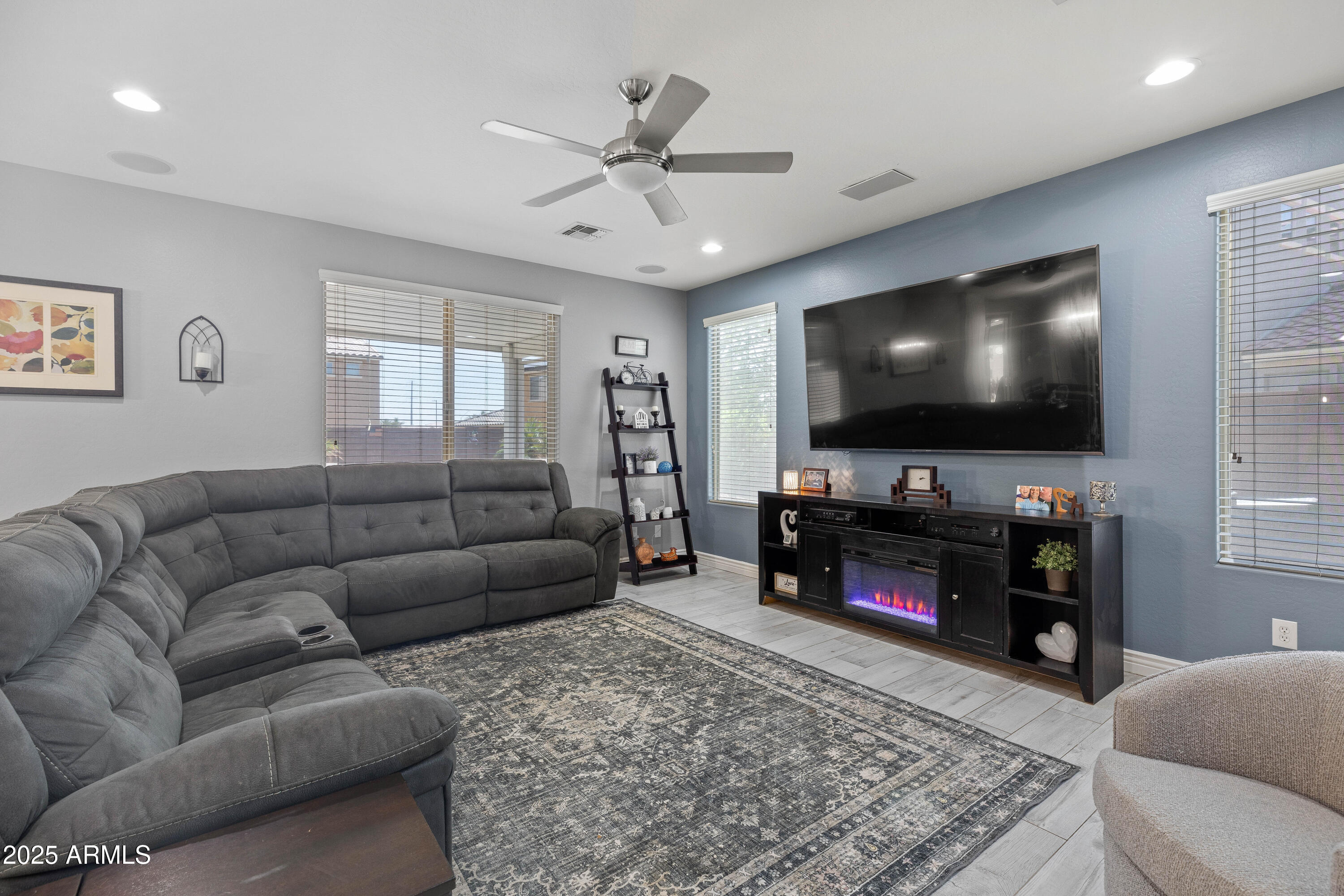 18649 West Williams Street Goodyear, AZ 85338 - Photo 6 of 42 a living room with furniture and a flat screen tv