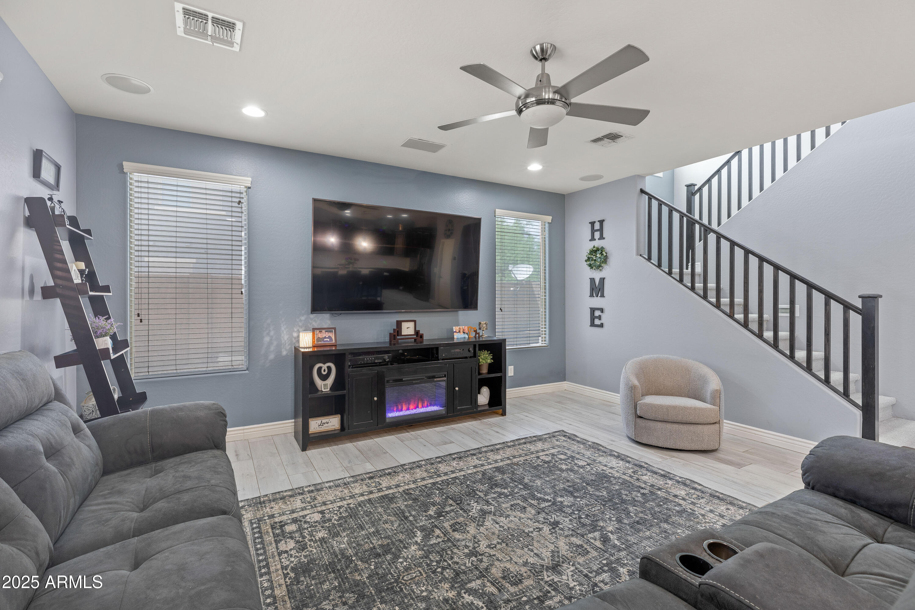 18649 West Williams Street Goodyear, AZ 85338 - Photo 7 of 42 a living room with furniture and a flat screen tv