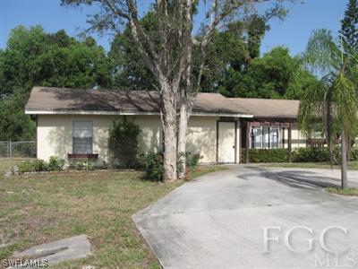 18320 Useppa Road Fort Myers, FL 33967 - Photo 1 of 10 a front view of a house with a garden