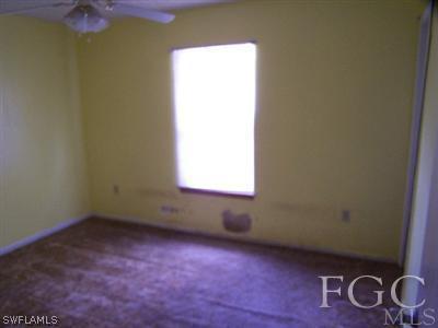 18320 Useppa Road Fort Myers, FL 33967 - Photo 6 of 10 an empty room with windows