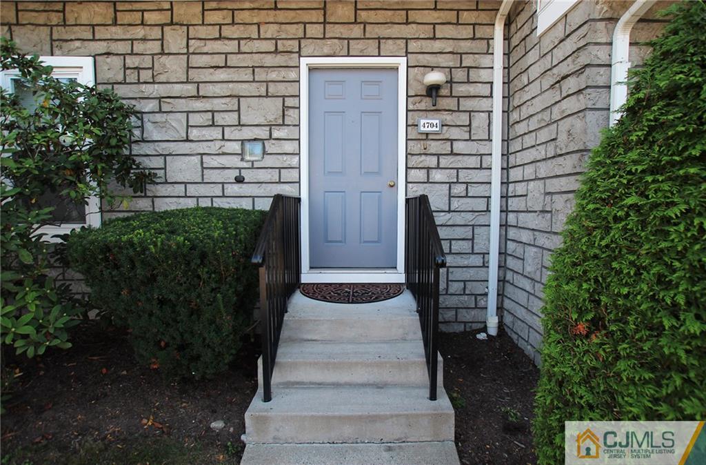 4704 Hana Road Edison, NJ 08817 - Photo 2 of 15 a pathway of a house with a yard
