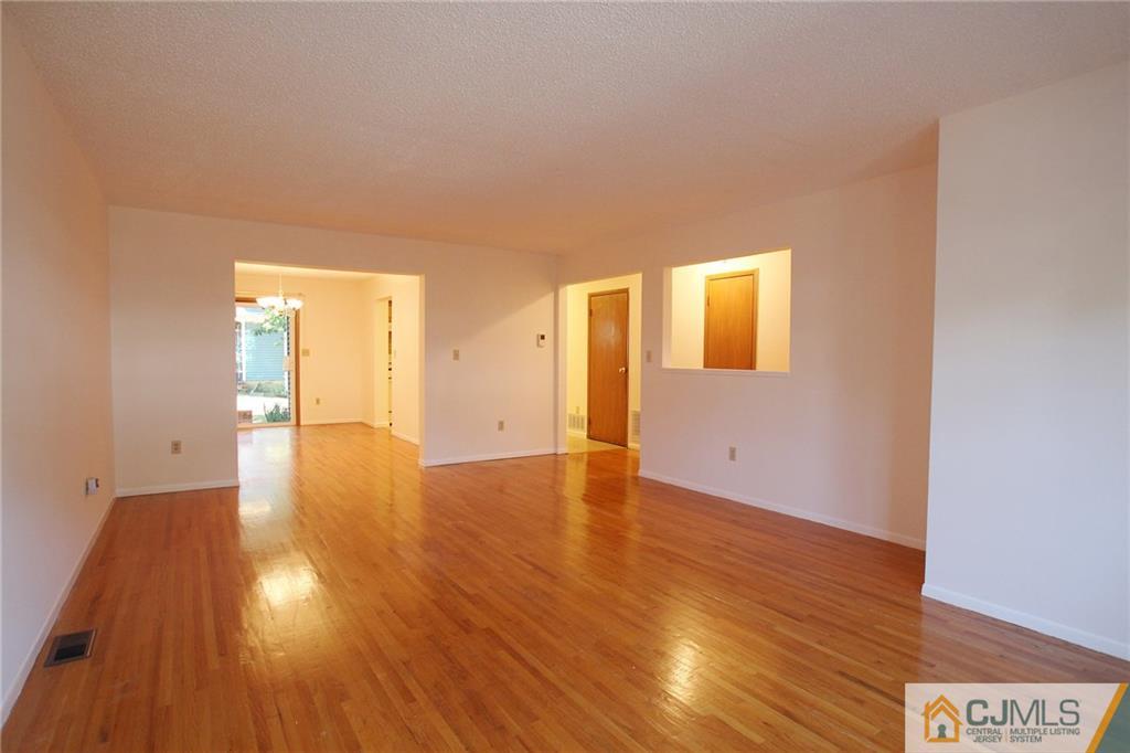 4704 Hana Road Edison, NJ 08817 - Photo 6 of 15 a view of an empty room and wooden floor
