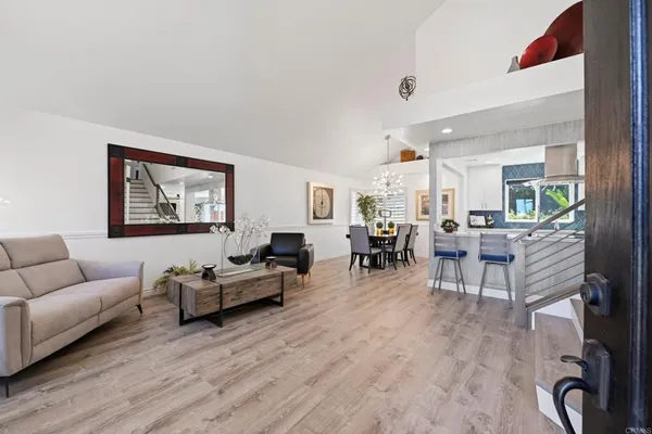 a view of a dining room with furniture and wooden floor