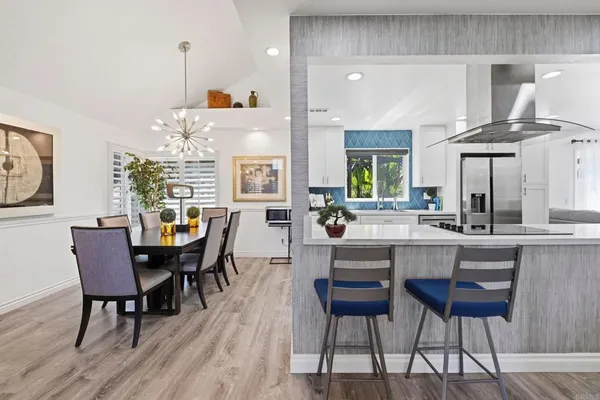 a kitchen with lots of counter top space and stainless steel appliances