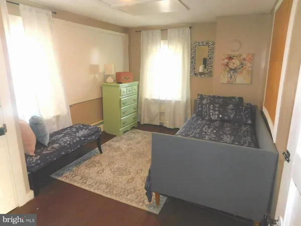 a living room with furniture and a rug