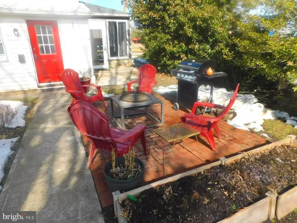 a view of a chairs and table in the patio