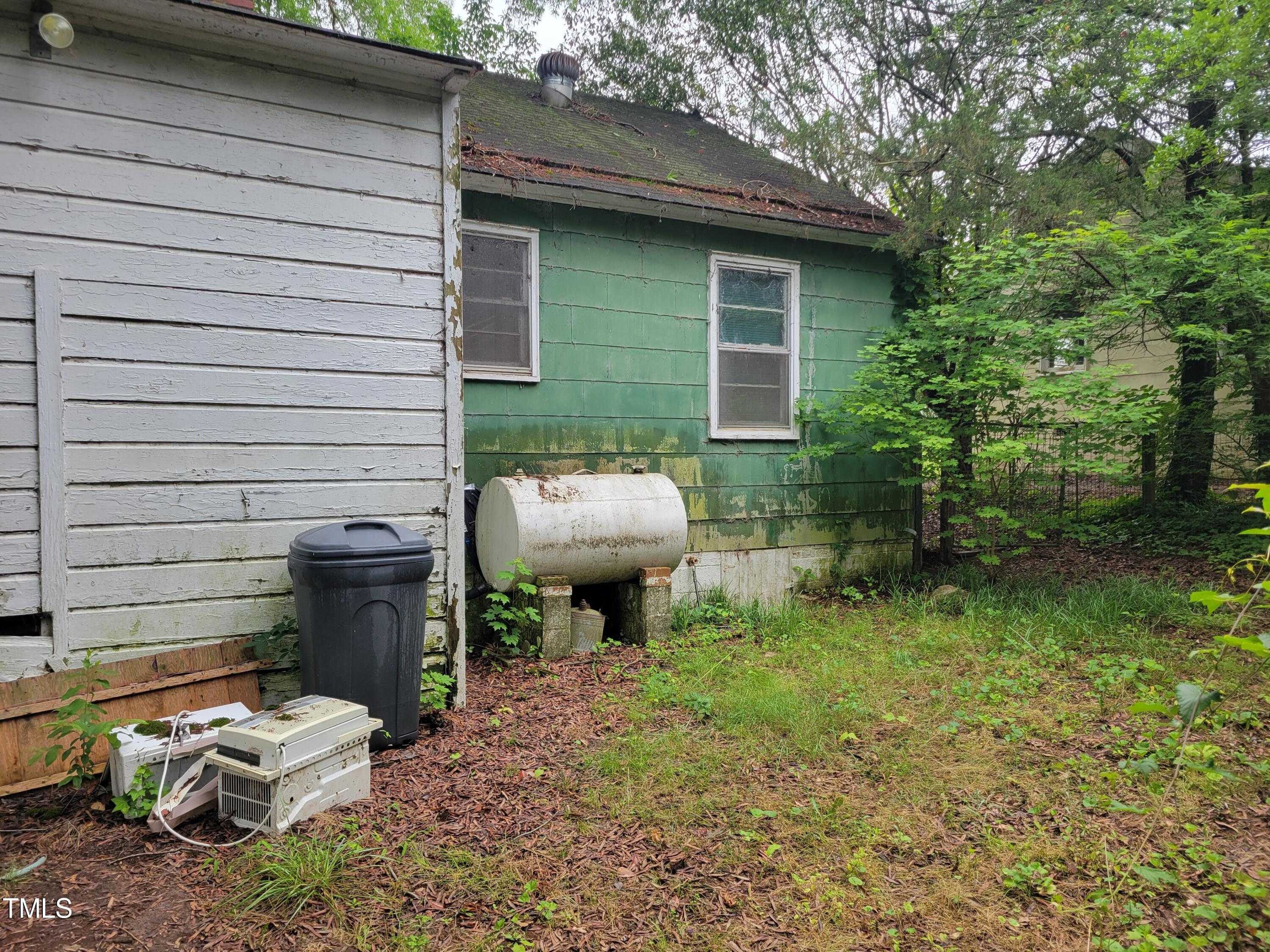 2521 Newbold Street Raleigh, NC 27603 - Photo 13 of 13 a view of a backyard with chairs and a fire pit