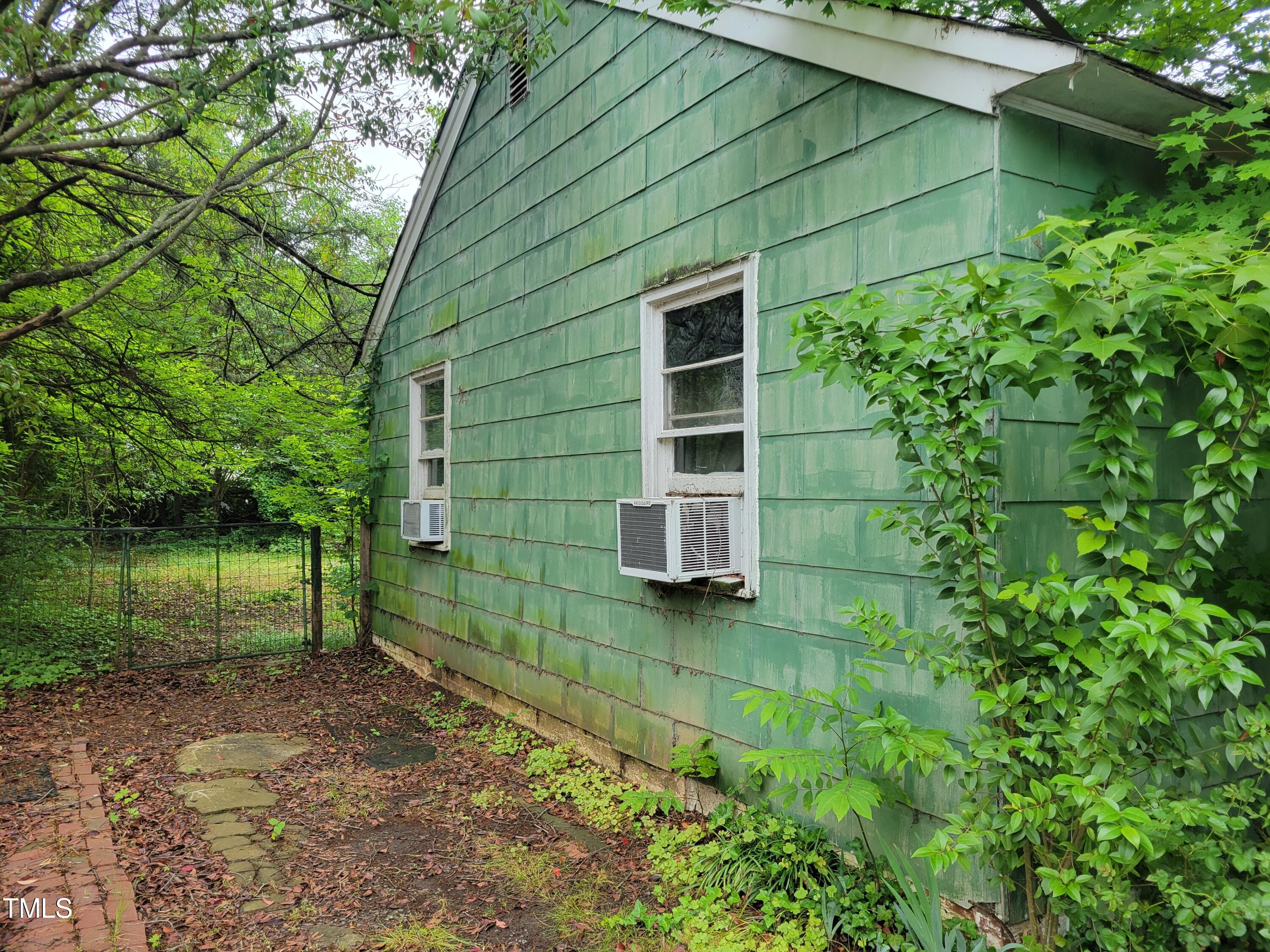 2521 Newbold Street Raleigh, NC 27603 - Photo 3 of 13 a backyard of a house with lots of green space