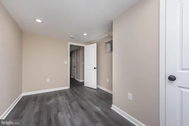 a view of hallway with wooden floor