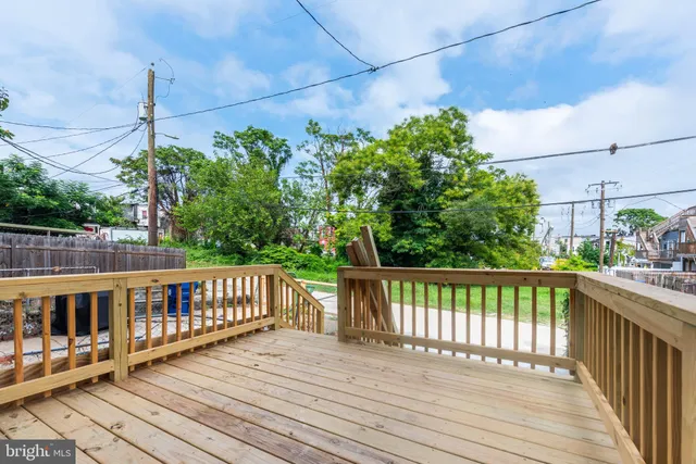 a view of a balcony with wooden floor