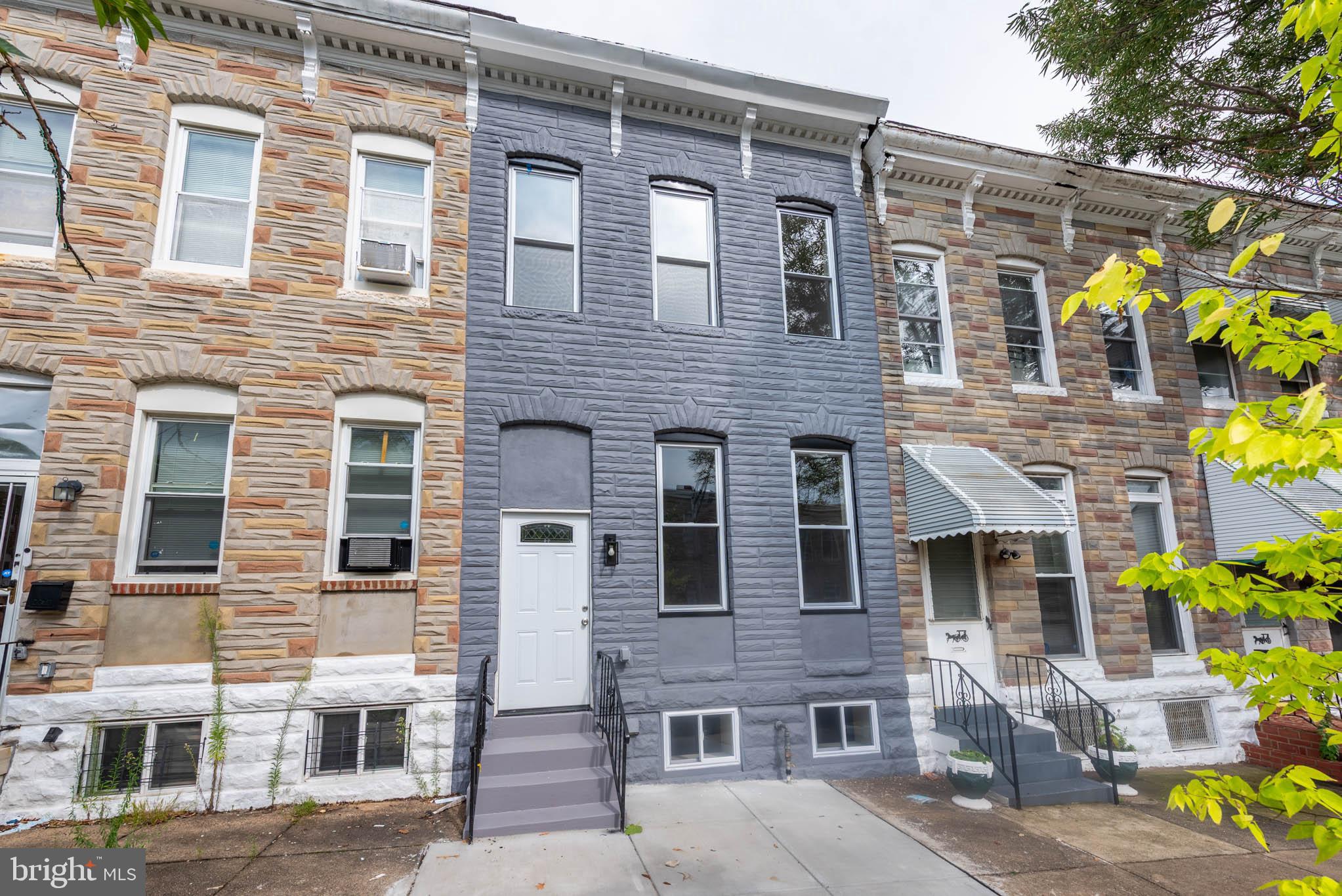 1713 North Bond Street Baltimore, MD 21213 - Photo 32 of 33 a front view of a building with a garden