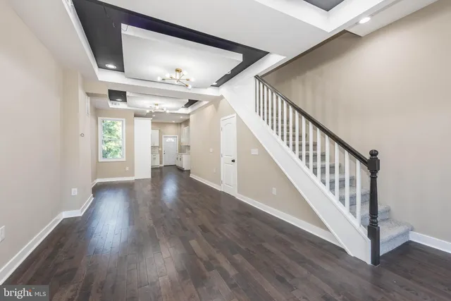 a view of an entryway with wooden floor