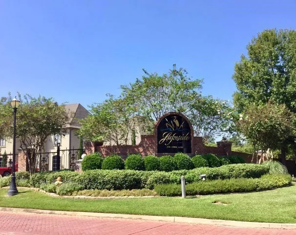 a view of a garden with a house