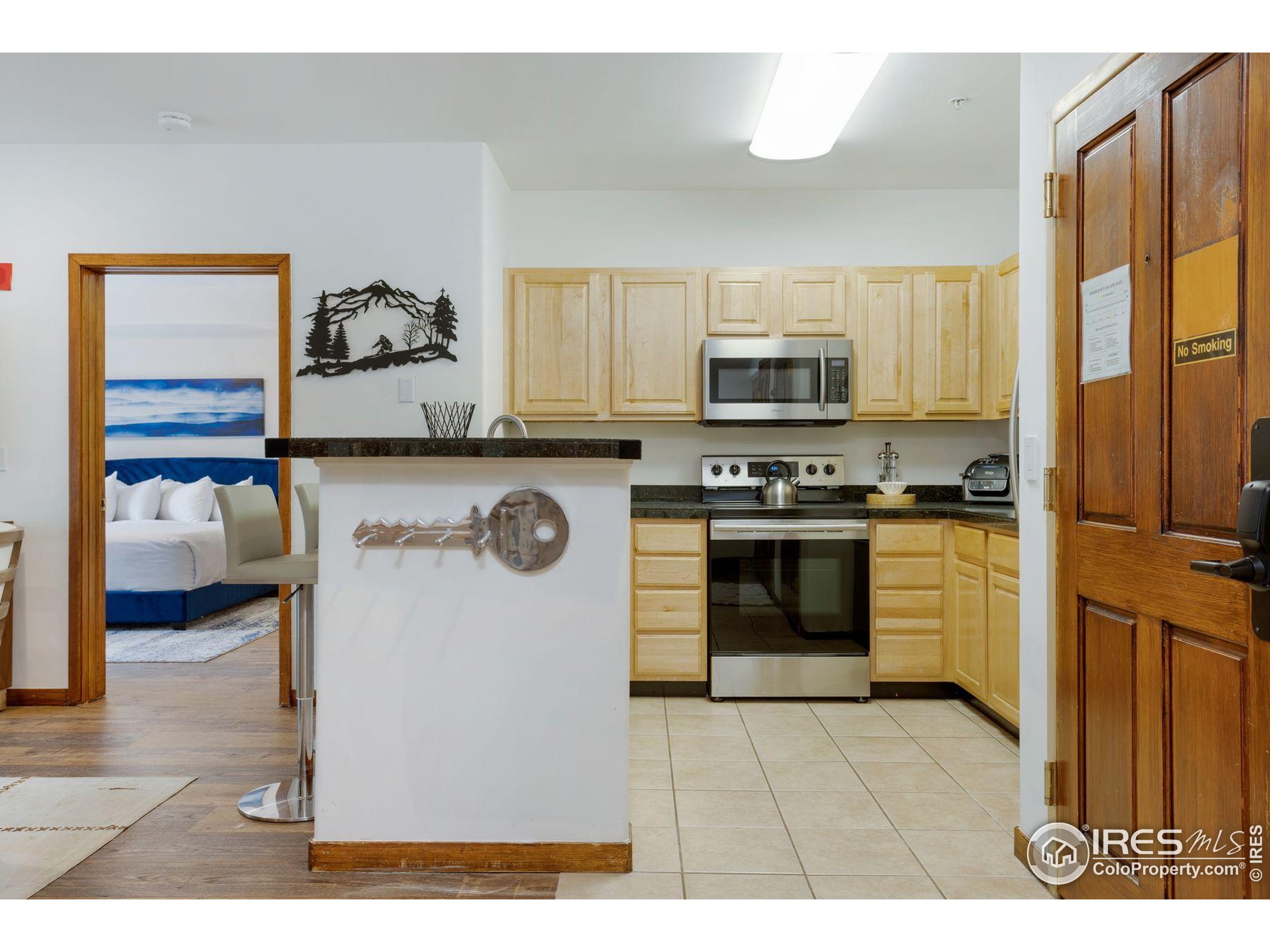 23110 Highway 6, Unit 5074 Dillon, CO 80435 - Photo 3 of 25 a kitchen with a stove a sink and a refrigerator